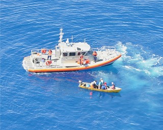 The crew of a Coast Guard Boat Station San Juan 45-foot Response Boat Medium prepares to embark nine Dominican migrants, following an at-sea interdiction by Caribbean Border Interagency Group partner agencies Oct. 8, 2013, approximately 29 nautical miles north of Aguadilla, Puerto Rico. The migrants were transferred to the Coast Guard Cutter Venturous and repatriated Oct. 10, 2013, during an at-sea transfer of the migrants to the Dominican Republic navy patrol boat Proción in waters off the coast of Santo Domingo, Dominican Republic. U.S. Coast Guard photo