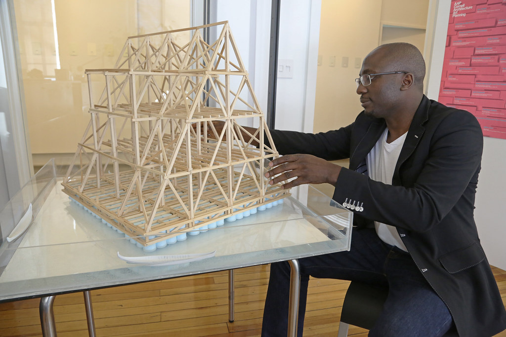 Adeyemi with student model in the Department of Architecture office.