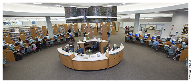 Interior of the Jan Platt library with help desk and public computer terminals