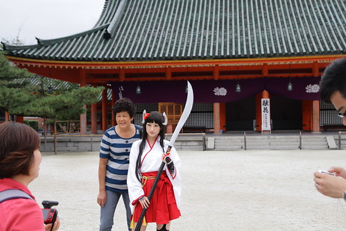 Tourist taking photo with cute cosplayer at Heian Shrine
