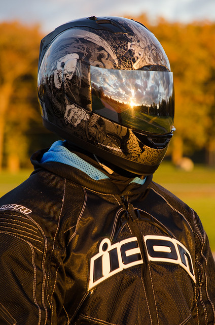 Sunset and clouds reflected in the visor
