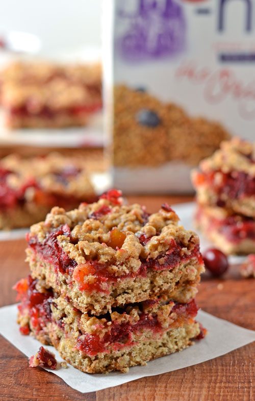 Two healthy cranberry apricot bars stacked on top of one another.