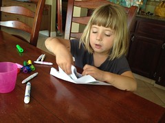 Emily works on a letter to Aunt Rachel and Uncle Mark in Hawaii