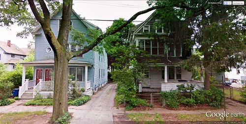 a nicely rehabbed home sits next to one in need of some TLC (via Google Earth)
