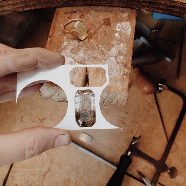 On the bench today: One gold ring ready to be polished and set, and the beginnings of a new piece using this fantastic 42ct Madagascan Quartz. I've started by cutting out an emerald cut shape from a sheet of silver, then filing it so the stone fits in to 