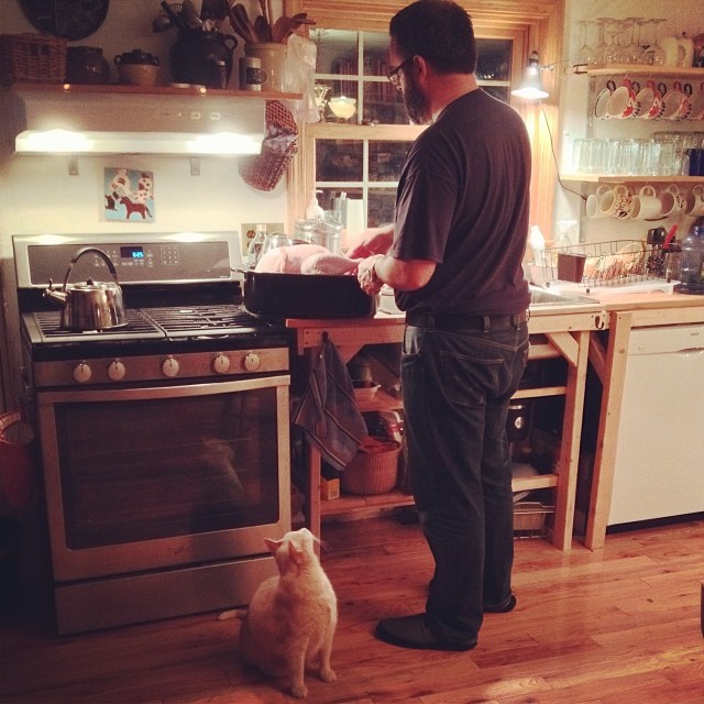 Max the cat is very interested in what Alex is doing for some reason. #thanksgiving #fromourkitchen