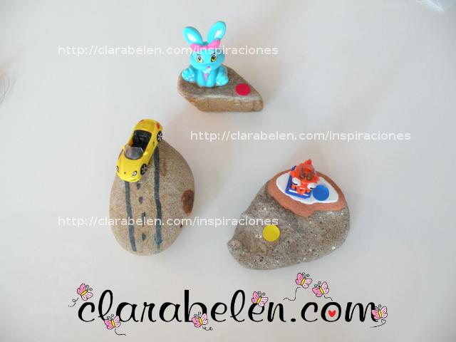 Pisapapeles para el dia del padre hecho con los niños con piedras y juguetes reciclados