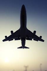 Commercial airliner landing by Greg Bajor