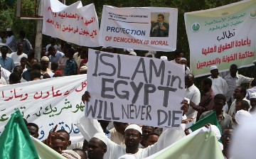 Sudanese supporters of the Muslim Brotherhood and Egypt's ousted president Mohamed Morsi protest following Friday noon prayers in front of the presidential palace in the capital Khartoum, on August 16, 2013. by Pan-African News Wire File Photos