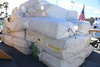 Several bales of marijuana seized from a panga sit on the deck of the Coast Guard Cutter Edisto before being transferred over the San Diego Marine Task Force at Naval Base Point Loma, Dec. 10, 2013. The 30-foot panga was intercepted approximately 155 miles south of San Diego. (U.S. Coast Guard photo by Petty Officer 3rd Class Connie Gawrelli)
