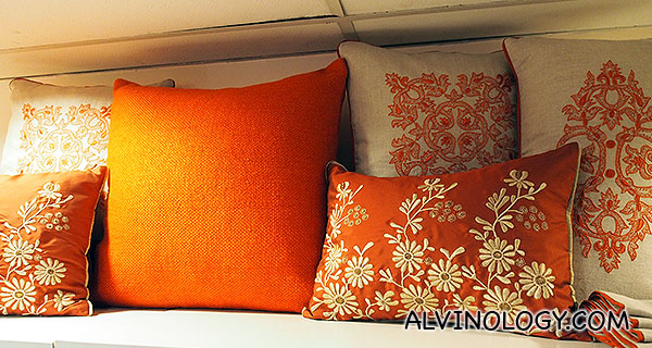Orange floral themed cushion covers 
