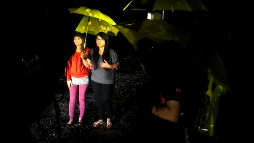 Lead actresses Wawa Zainal and Elliza Razak acting in the rain