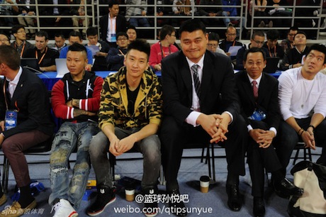 October 15, 2013 - Yao Ming watches an NBA preseason game in Beijing with friend Sun Yue