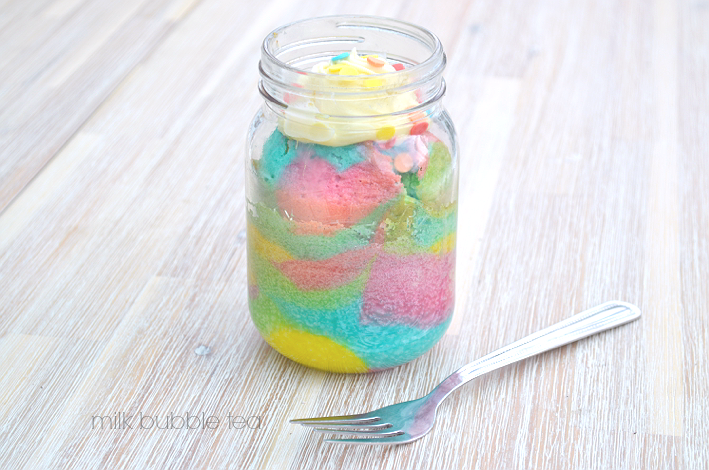 pastel rainbow cake in a jar