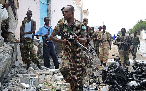 Somalian soldiers outside the United Nations compound that was bombed on June 18, 2013. The Al-Shabaab organization claimed responsibility. by Pan-African News Wire File Photos