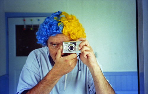 reflected self-portrait with Olympus mju V camera and blue and yellow hair by pho-Tony