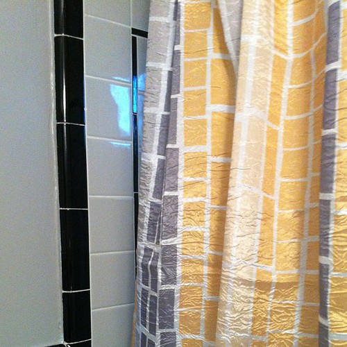 The new wall paint, vintage tile and new shower curtain live in harmony together. Very lucky choices! #nofilter #homedecor