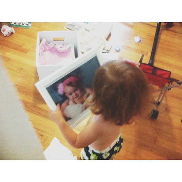Lucy holding a picture of Margot