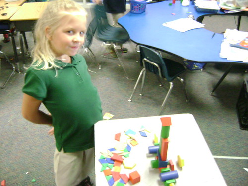 girl displays a structure she built