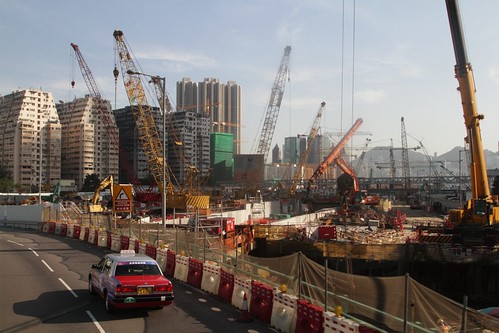 Cranes tower over a massive hole at the future West Kowloon Terminus