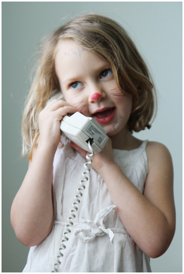 Five year old pretend chatting on the phone