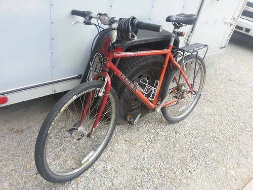 Bike leaning against a cargo trailer