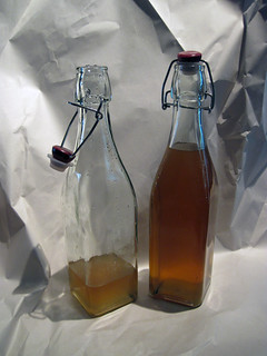 Two bottles of Finished Pear and Ginger Vodka
