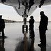 Air Force Ground Crew Keeps Dry Awaiting Secretary Kerry