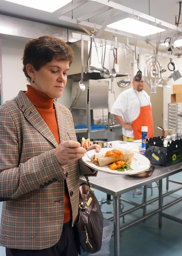 Deputy Harden samples a chicken curry crepe with mango sauce created by Sharmini’s Kitchen in the YorKitchen Incubator.