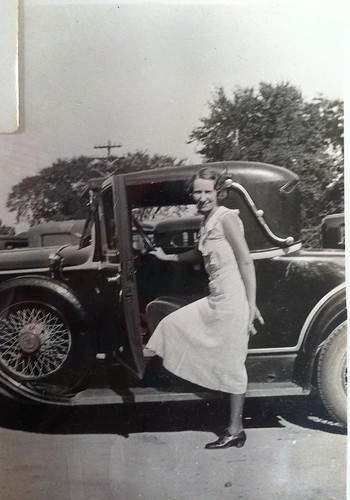 Cary Franklin posing with her father's car