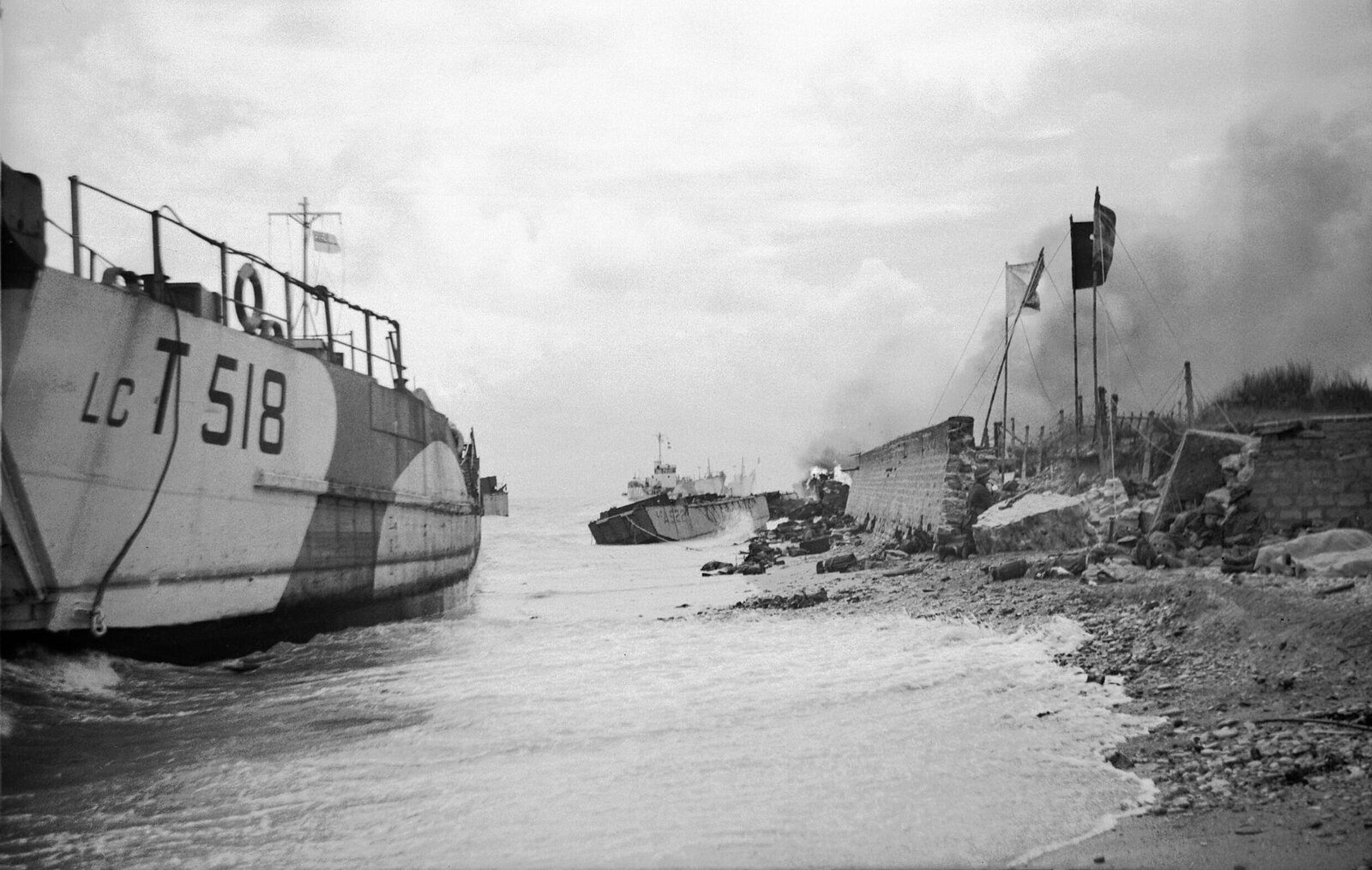 Wrecked landing craft on Nan Red beach, Juno area, at St Aubin-sur-Mer, 6 June 1944.