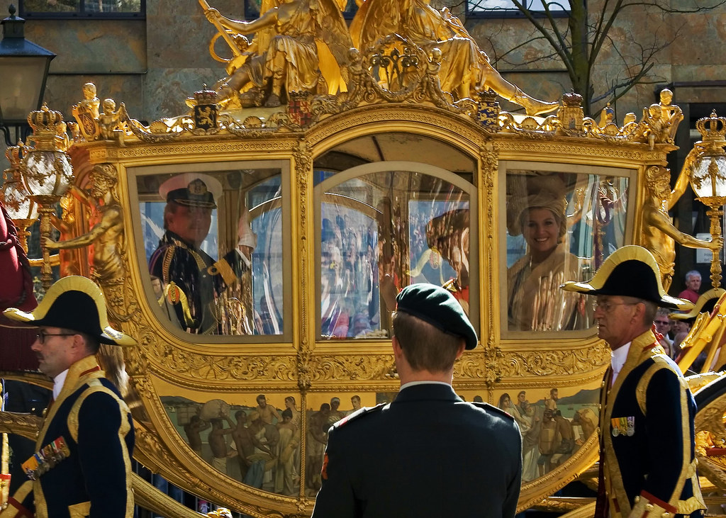 The Gold Coach with Prince Willem-Alexander, Queen Beatrix, and Princess Máxima. Credit Toni
