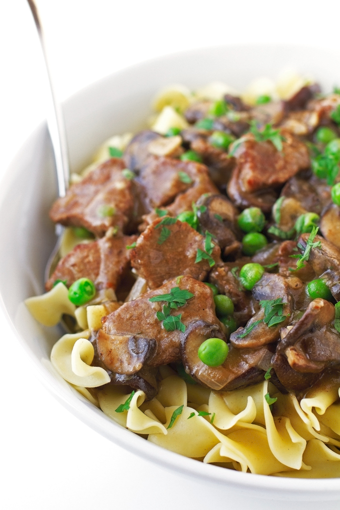 Beef Stew with Mushrooms over Egg Noodles - An easy to make stew with just a 20 minute prepwork! #stew #pasta #beefstew #dutchoven | Littlespicejar.com