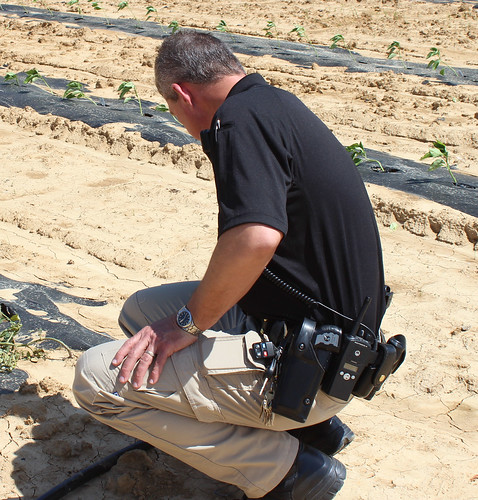 Hopkins County, Kentucky jailer Joe Blue inspects irrigation pipeline at the jail’s garden. The jail’s gardening program offers inmates the opportunity to work outside planting, growing, and harvesting food for hundreds of people. NRCS photo by Christy Morgan.
