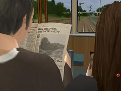 Reading the newspaper over a strangers shoulder (Trainz 2009 screenshot)