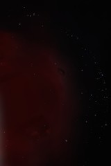 Black Hole over Red Nebula