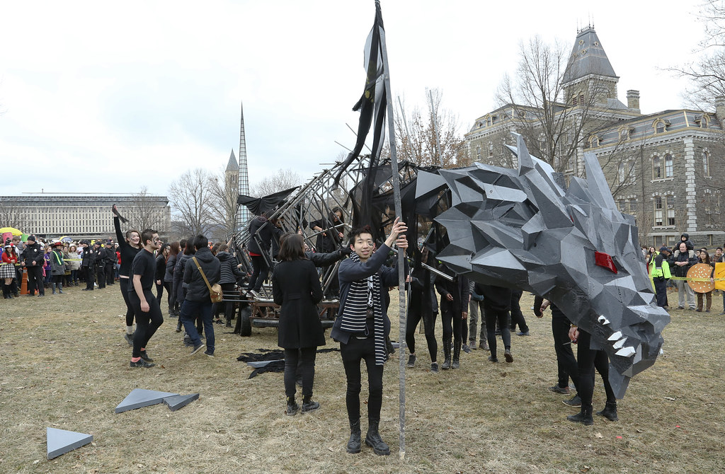 First-year students celebrate as the 2015 dragon comes to rest on the arts quad.