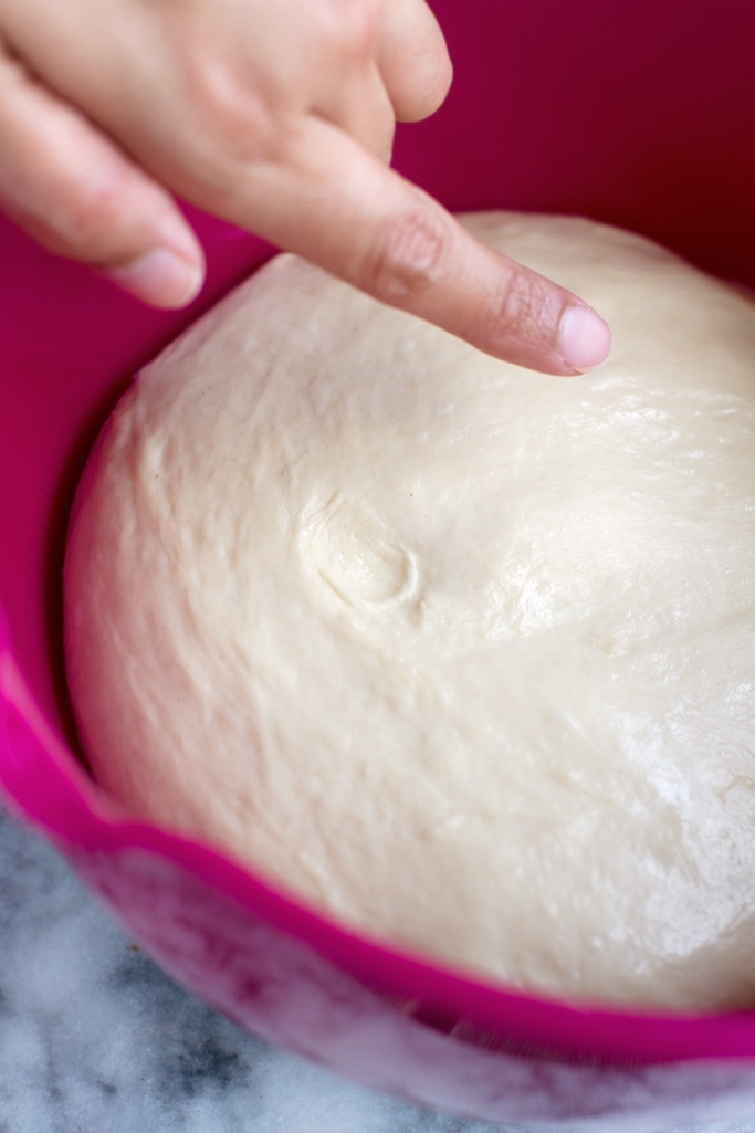 Perfect Homemade Pizza Dough - made with NO REFINED SUGARS and easy to follow with step-by-step directions! #homemadepizza #pizzadough #homemadepizzacrust | Littlespicejar.com