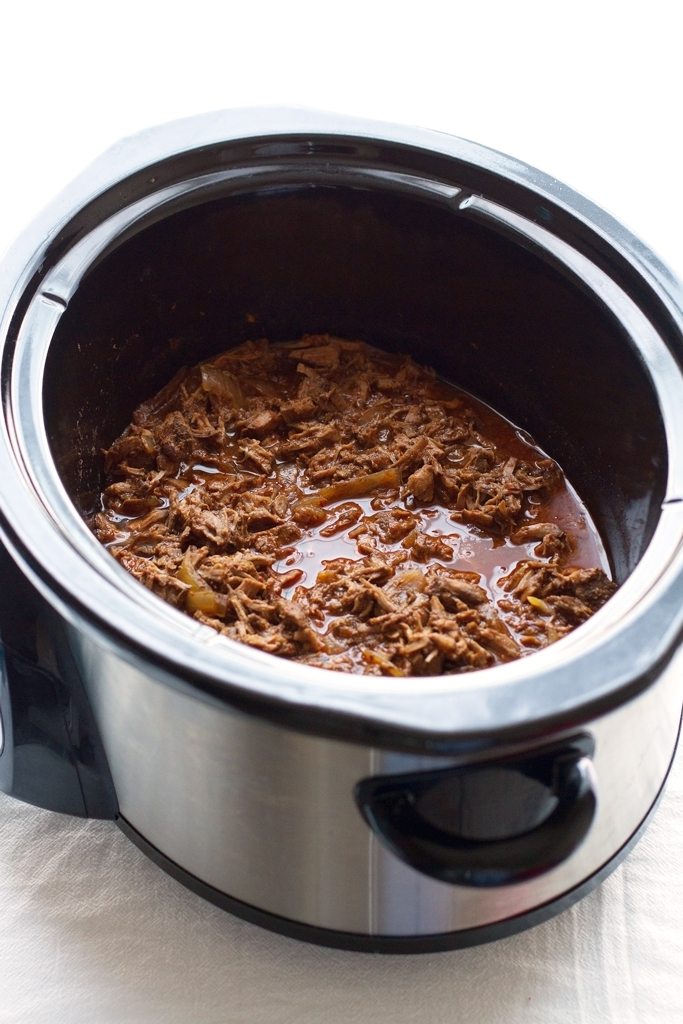 Slow cooked barbacoa beef that is just exploding with flavor! It's simple to make, requires no babysitting, and the meat is just fall-apart tender and delicious. Use this shredded beef on tacos, burritos, salads or anything else you please! #barbacoabeef #barbacoa #slowcooker #chipotle | Littlespicejar.com