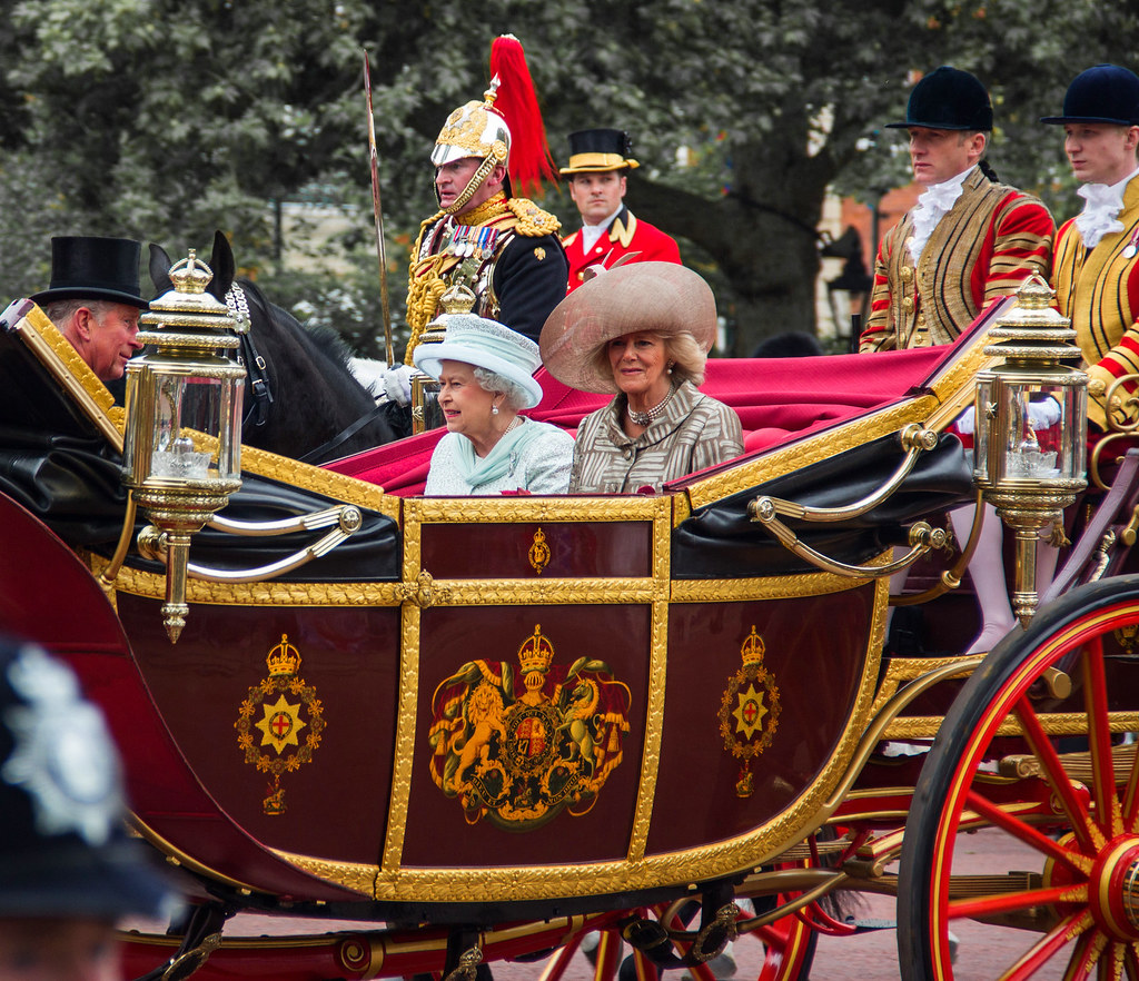 The Queen, along with the Duke and Duchess of Cornwall, rides in the 1902 State Landau during a procession as part of the celebrations of her Diamond Jubilee, 2012. Credit Ben