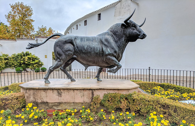 bull statue in front of the bullring