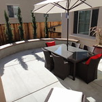 Broom finish courtyard patio with seating wall. 