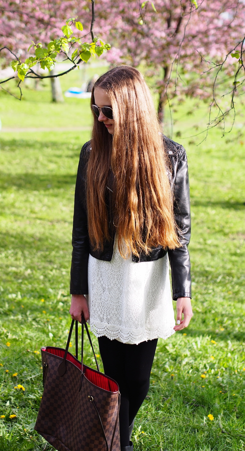 White lace dress, black leather jacket and tights, black booties and Neverfull bag