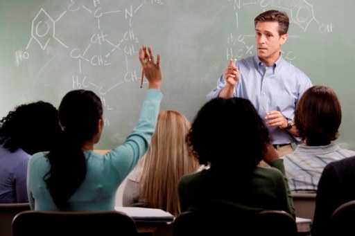 Chemistry Teacher with Students in Class --- Image by ฉ Royalty-Free/Corbis