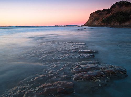 sunset newzealand sky reflection beach rocks waves dusk auckland northshore