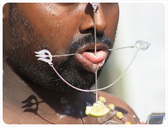 devotee with tongue piercing at thaipusam