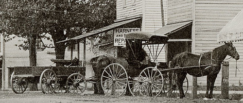 horses usa signs history cars buildings advertising awning hardware indiana streetscene transportation drugs shops storefronts buggy buggies automobiles banks businesses wagons barbers claypool realphoto kosciuskocounty hoosierrecollections vonepageqffalse