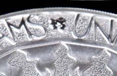 2012 Olympic logo. Silver coin crop.