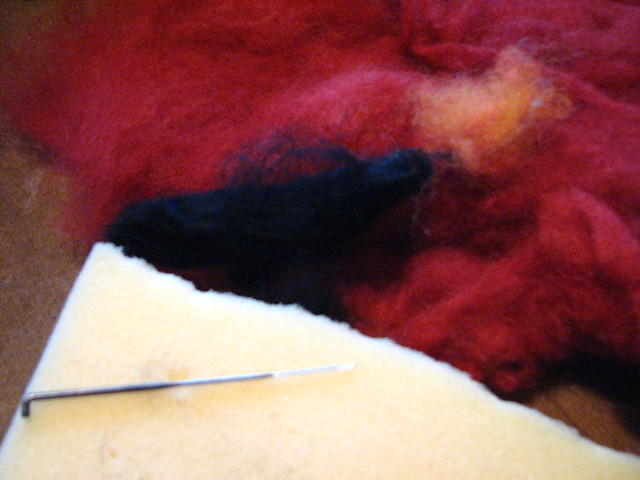Materials needed to make a needle felted cardinal