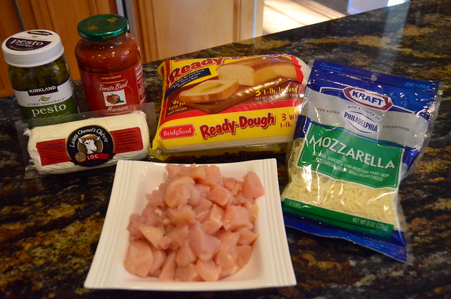 The calzone ingredients arranged on a kitchen counter.